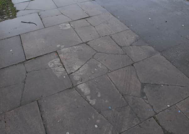 Cracks in the pavement, Coneygree road, by junction with lawson avenue, stanground