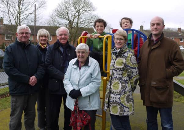Brothers Tobias aged 7 and Archie aged 9 with members of the Neighbourhood Development Plan committee with 90 year old Barbara Phillips who came to the parish as a land girl in 1943, met a local lad and never left SUS-150415-105508001