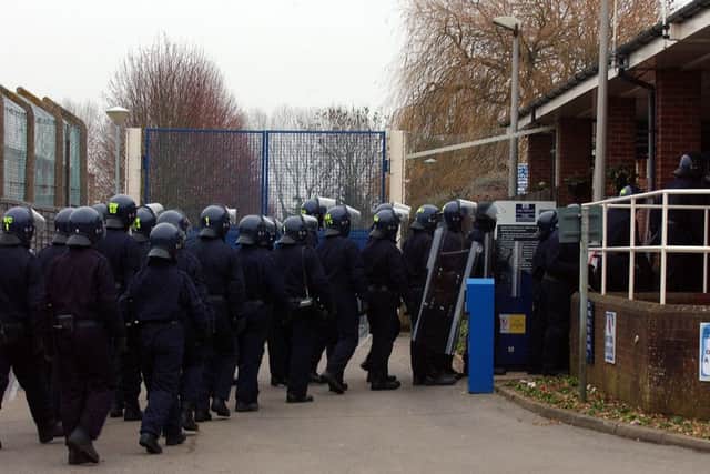 Specialist riot police breaching the prison during the New Year's Day riot on 2011