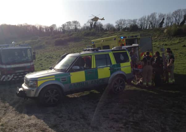 Road and air ambulances attend a man who fell off his mountain bike on a track in Steyning - picture contributed by the Sussex Road Policing Unit