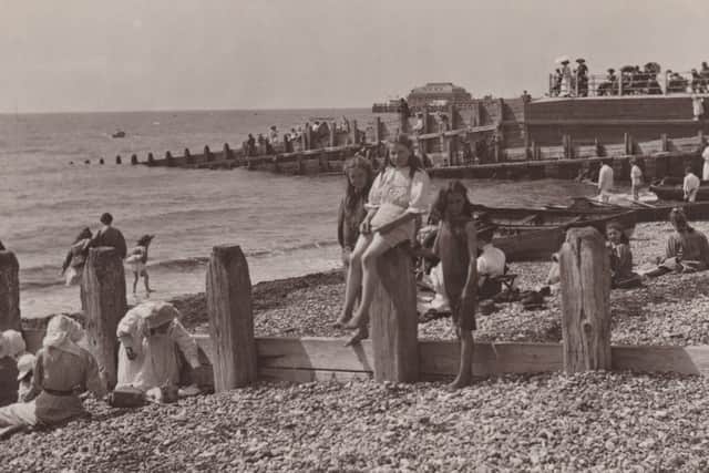 Children at Splash Point, with the pier in the distance