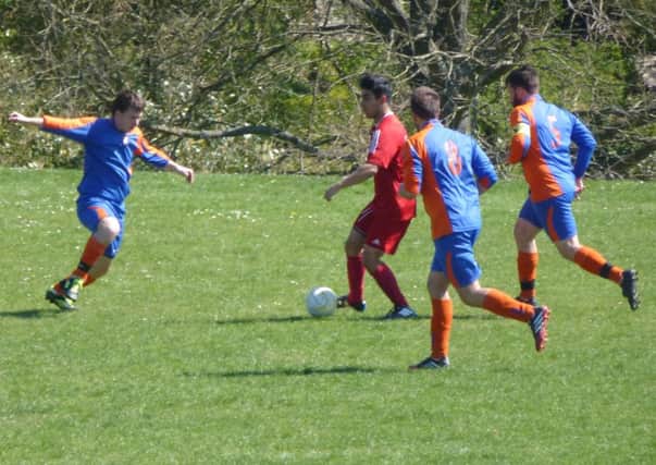 Action from Battle Baptists II's 7-1 win over Magham Down in Macron East Sussex Football League Division Five. Picture by Simon Newstead (SUS-150418-202057002)