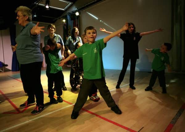 Children at Queen Elizabeth II Silver Jubilee School practising for Dance Time SUS-150420-162700001