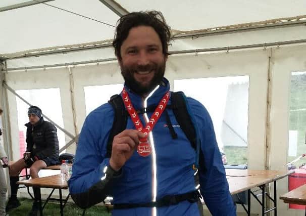 John Taylor of The Richard Onslow Cranleigh runs a marathon SUS-150420-170526001