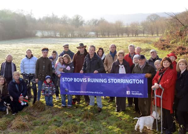 WSCT 161241  Protesters from the Stop Bovis Ruining Storrington Action Group at the western edge of Storrington pictured in late 2014. Photo by Derek Martin SUS-141216-165204001