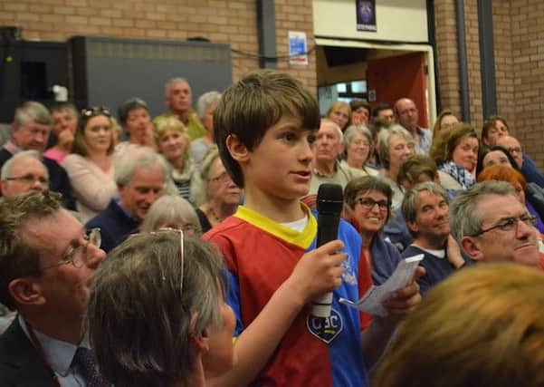 Ten-year-old Robin Boyle asks a question at Steyning Grammar School's election debate