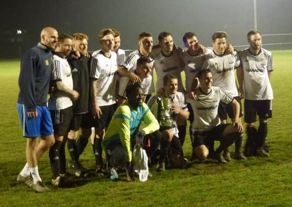 Bexhill United celebrate after winning the Hastings & District FA Senior Cup earlier this month