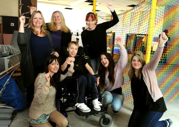 Alfie Buck and his mum Sam with Natalie Gazey, Alfie's carer Victoria Nightingale and Horsham's Hop, Skip and Jump team. Mums' campaign for a Hop Skip Jump disabled children's cr?che facility in Horsham has come to fruition and work has started on one in Swan Walk Shopping Centre. Pic Steve Robards SUS-150605-114913001