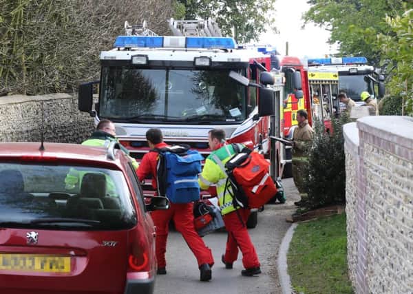 Emergency services attended the scene in Patching where a man was trapped by a tractor. Picture by Eddie Mitchell