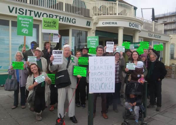 Green supporters gather outside Worthing Dome