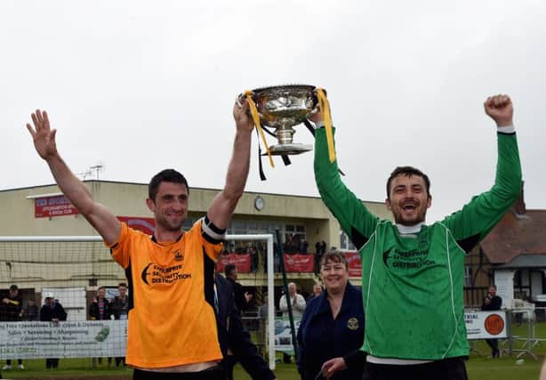Joe Shelley and Jon Hendrick lift the County League title on Saturday