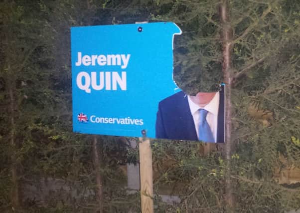 Jeremy Quin poster vandalised in Guildford Road (JJP/Johnston Press). SUS-150427-094810001