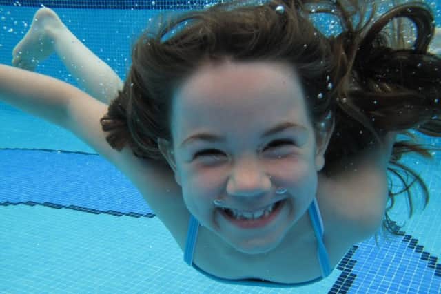 One of the happy customers underwater at Arundel Lido SUS-150427-164446001