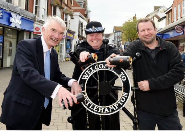 Trader Andrew Sleeman, left, with PCSO Kelly Mankelow and councillor Malcolm  Belchamber, of Littlehampton Town Council