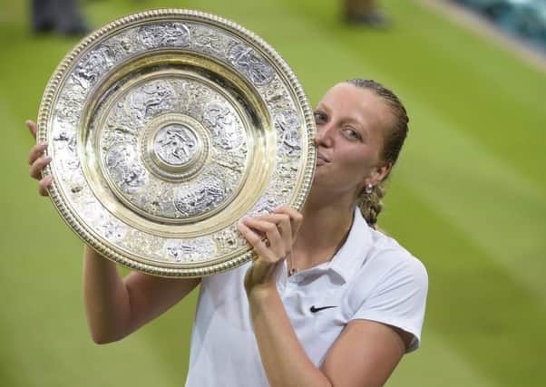 Petra Kvitova with the 2014 Wimbledon Trophy