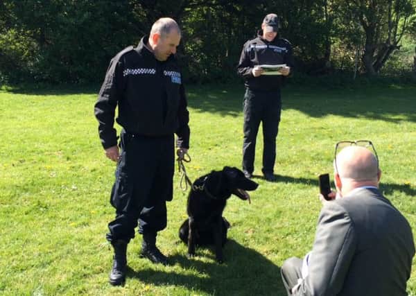Sgt Chris Sutherland with sniffer dog at Brookland Pleasure Park Worthing SUS-150428-144715001