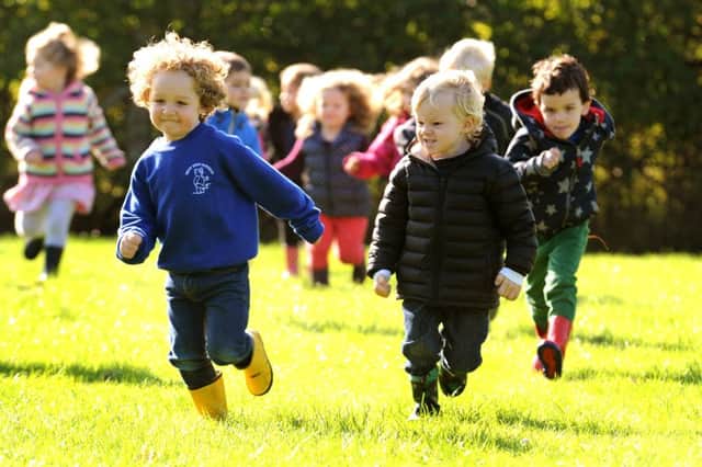 Next Step Nursery children exercise at the play meadow at Courtmead, Cuckfield. Pic Steve Robards