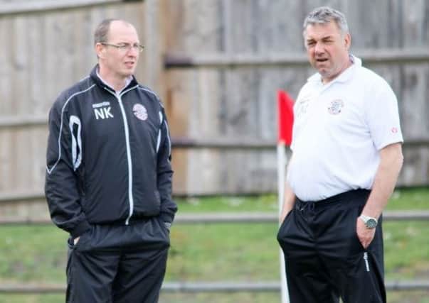 Nigel Kane, pictured left with John Masters, will not be continuing as Hastings United manager next season. Picture courtesy Joe Knight