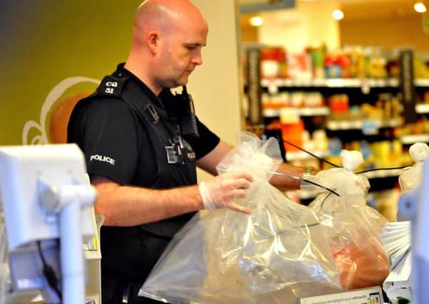 Police gather evidence after a serious incident in the Waitrose store at Storrington. 29-04-15, Pic Steve Robards SUS-150429-202445001