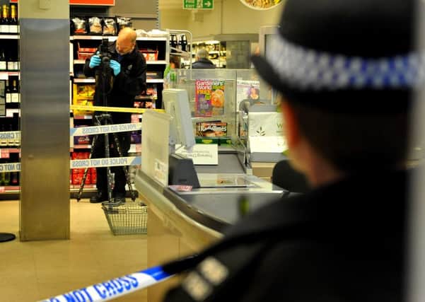 Police gather evidence after a serious incident in the Waitrose store at Storrington. 29-04-15, Pic Steve Robards SUS-150429-202612001