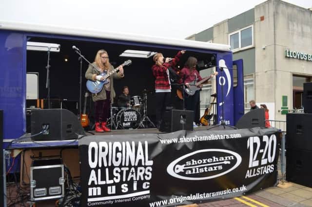 Young musicians performing on Original Allstars Musics own converted truck stage at the Brighton Marathon