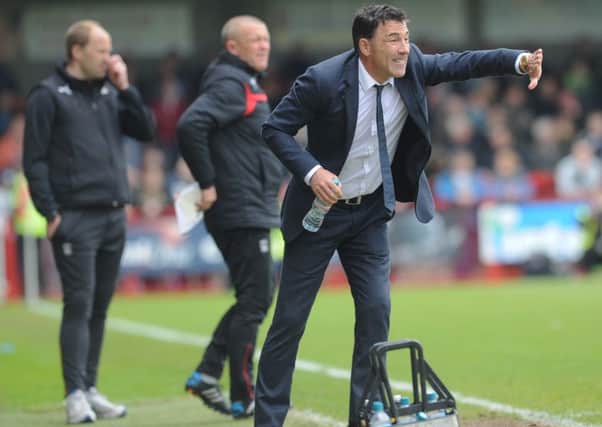 Crawley Town boss Dean Saunders watches his side against Coventry City (Pic by Jon Rigby) SUS-150405-140421008