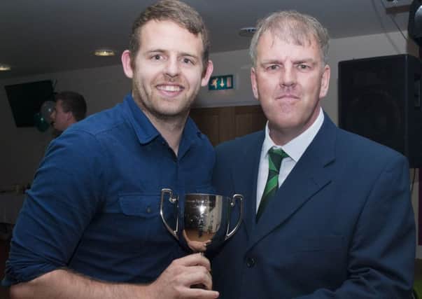 Dan Sackman receives his award from David Seabourne of the supporters' club / Picture by Tommy McMillan