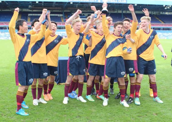 The national title-winning Buckswood School football team celebrates at St Andrew's