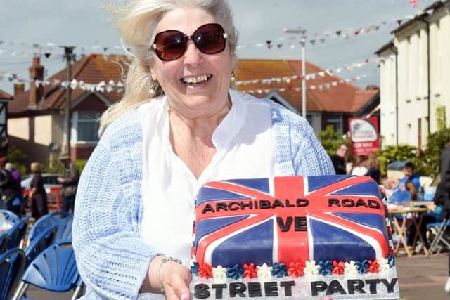 Jackie Bown, one of the organisers, with the street party cake. Picture: Liz Pearce 09-05-15
LP1501693 SUS-150905-201404008