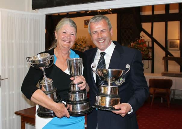 HHGC Ladies' Captain, Kath Honeysett and the Club Captain, Mark Gerken, who won both the Atchley and Coronation Cups.
