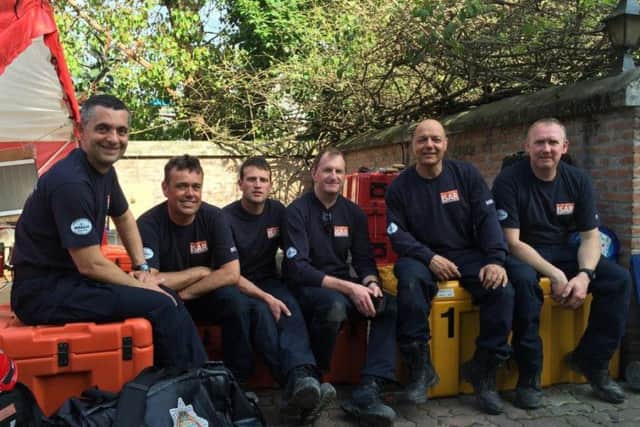 Horsham firefighter Owen Marfany (far left) was one of a team from West Sussex Fire and Rescue Service that flew to Nepal after a devastating earthquake in April 2015