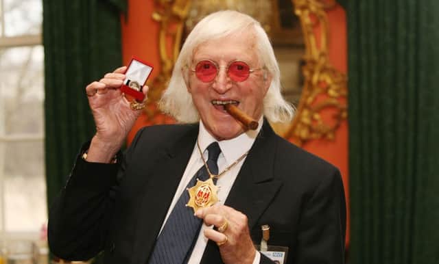 Sir Jimmy Savile after he received a commemorative badge from Prime Minister Gordon Brown at Downing Street in London for his work as a 'Bevin Boy'. Picture date: Tuesday 25th March, 2008. The "Boys", who worked in Britain's coal mines during the Second World War, are being recognised with a special honour to mark their service. See PA story POLITICS Bevin. PRESS ASSOCIATION Photo. Photo credit should read: Lewis Whyld/PA Wire ENGPNL00120131101104305