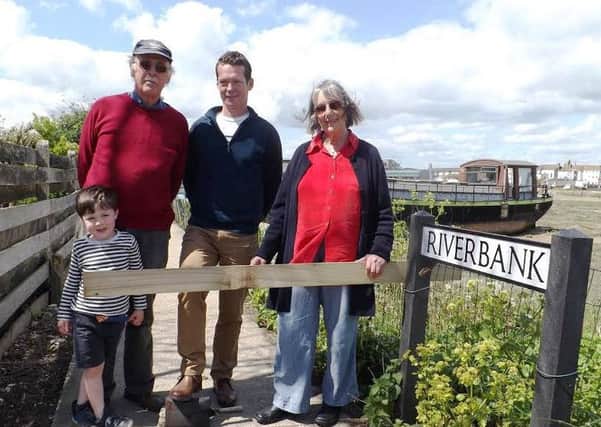 Former chairman of the Adur Houseboat Association, Mike Wooldridge with his grandson Wilson Machin, Jon Potter, chairman of the Adur Houseboat Association and Jess Aidley-jermain, secretary of AHA SUS-151205-155837001