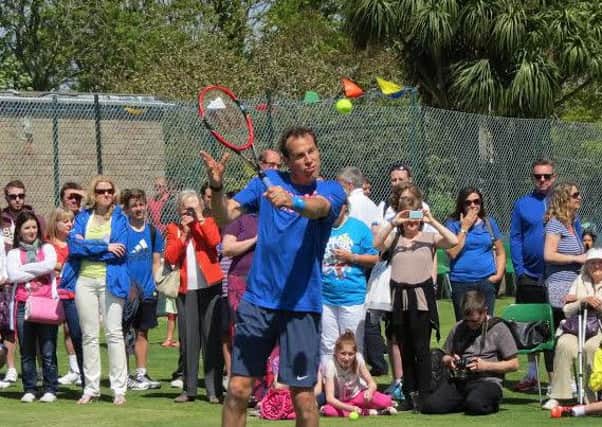 Greg Rusedski in action in the exhibition match