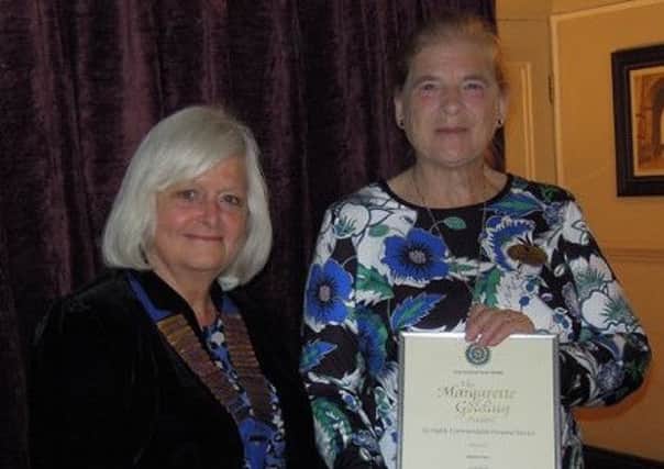 Margaret Pullen being presented the award by Wendy Eve, the President of Arundel Inner Wheel, at their meeting at The Ship Hotel. SUS-150513-125616001