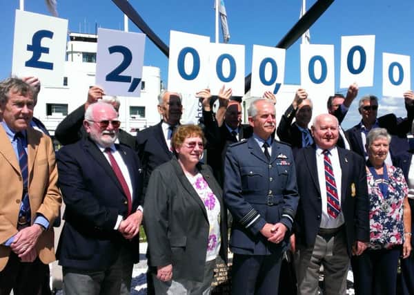 The Shoreham Airshow committee celebrates passing the £2million mark with RAFA president Sir Dusty Miller