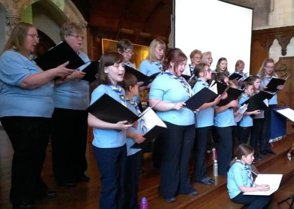 The Sussex West Guide Choir performing in Arundel Castle for the county annual review
