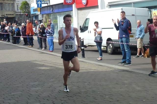 Hastings Runners Five Mile Race winner Ross Skelton approaches the finish line