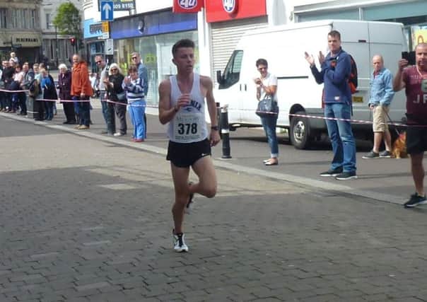 Hastings Runners Five Mile Race winner Ross Skelton approaches the finish line