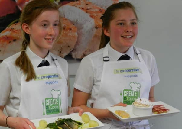 Winning pair Charlotte Cole and Jasmine Cheeseman show off their dishes SUS-150514-160333001