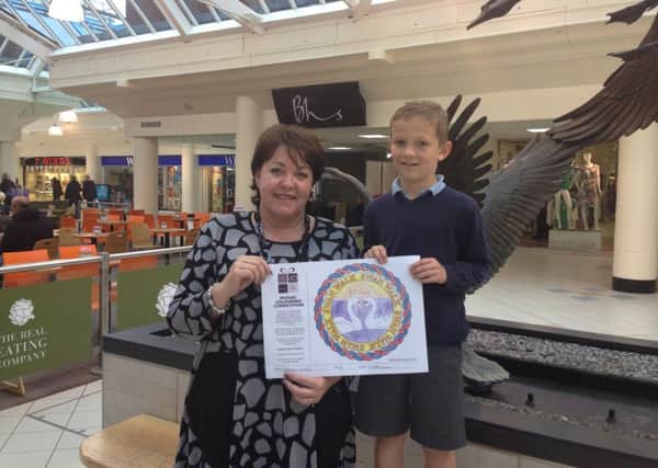 Eight-year-old Nathan with  Swan Walk centre manager Gill Buchanan