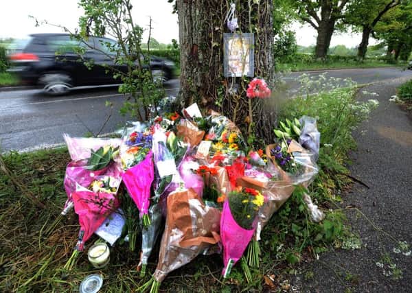 Floral tributes at the scene of a fatal RTC east of Partridge Green. SR1510502. Pic Steve Robards SUS-150518-143903001