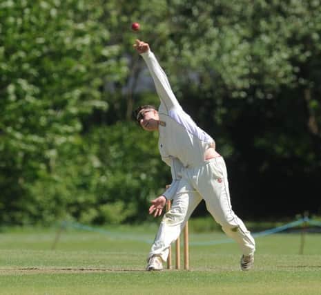 Jed O'Brien bowling for Hastings Priory against Three Bridges. Picture by Jon Rigby (SUS-150518-100641008)