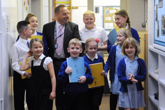 Changes ahead - Tangmere Academy head Paul Turney with members of the school council.LA1500119- SUS-150518-210451008