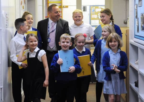 Changes ahead - Tangmere Academy head Paul Turney with members of the school council.LA1500119- SUS-150518-210451008