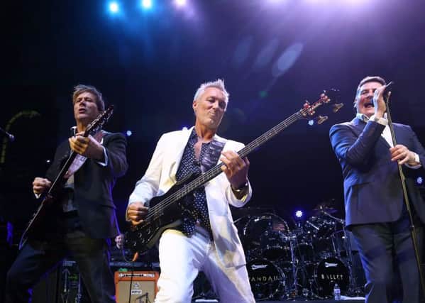 LONDON, ENGLAND - DECEMBER 01:  Steve Norman, Martin Kemp and Tony Hadley of Spandau Ballet perform as Magic present Spandau Ballet at LSO St Lukes on December 1, 2014 in London, England.  (Photo by Tim P. Whitby/Getty Images) TSP-151003-211301003