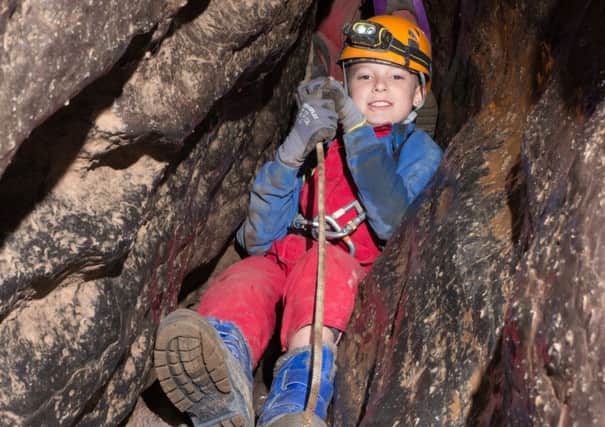 Jamie Chappell, new member of 1st Rudgwick Scouts has been out enjoying caving, despite his cerebral palsy - picture by Paul Fretwell (contrubuted)