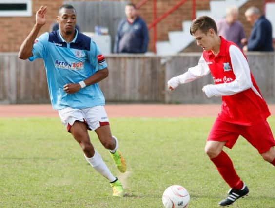 Tyrell Richardson-Brown closes down an opponent during Hastings United's 2-2 draw away to Walton & Hersham on the final day of the 2014/15 season. Picture courtesy Joe Knight