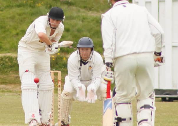 Worthing wicketkeeper Ian Gooding watches on as Elliott Hooper bats for Hastings on Saturday