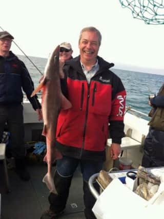 Nigel Farage with his catch. Picture supplied by Littlehampton harbour